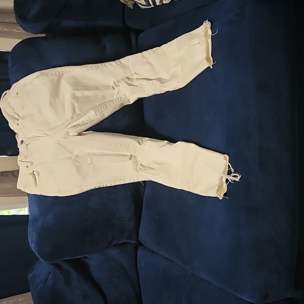 Distressed White Midrise skinny jeans size 8, inseam 29.